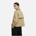 Women's short double-breasted trench coat with a belted waist and high collar