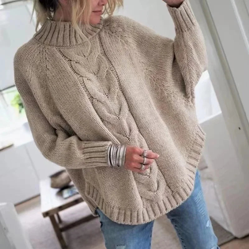 Women's cable-knit wool sweater with a mock neck