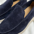 Men’s slip-on loafers with visible stitching and contrasting sole