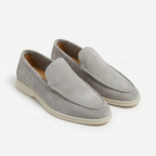 Men’s slip-on loafers with visible stitching and contrasting sole
