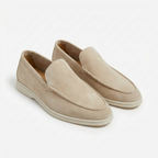 Men’s slip-on loafers with visible stitching and contrasting sole