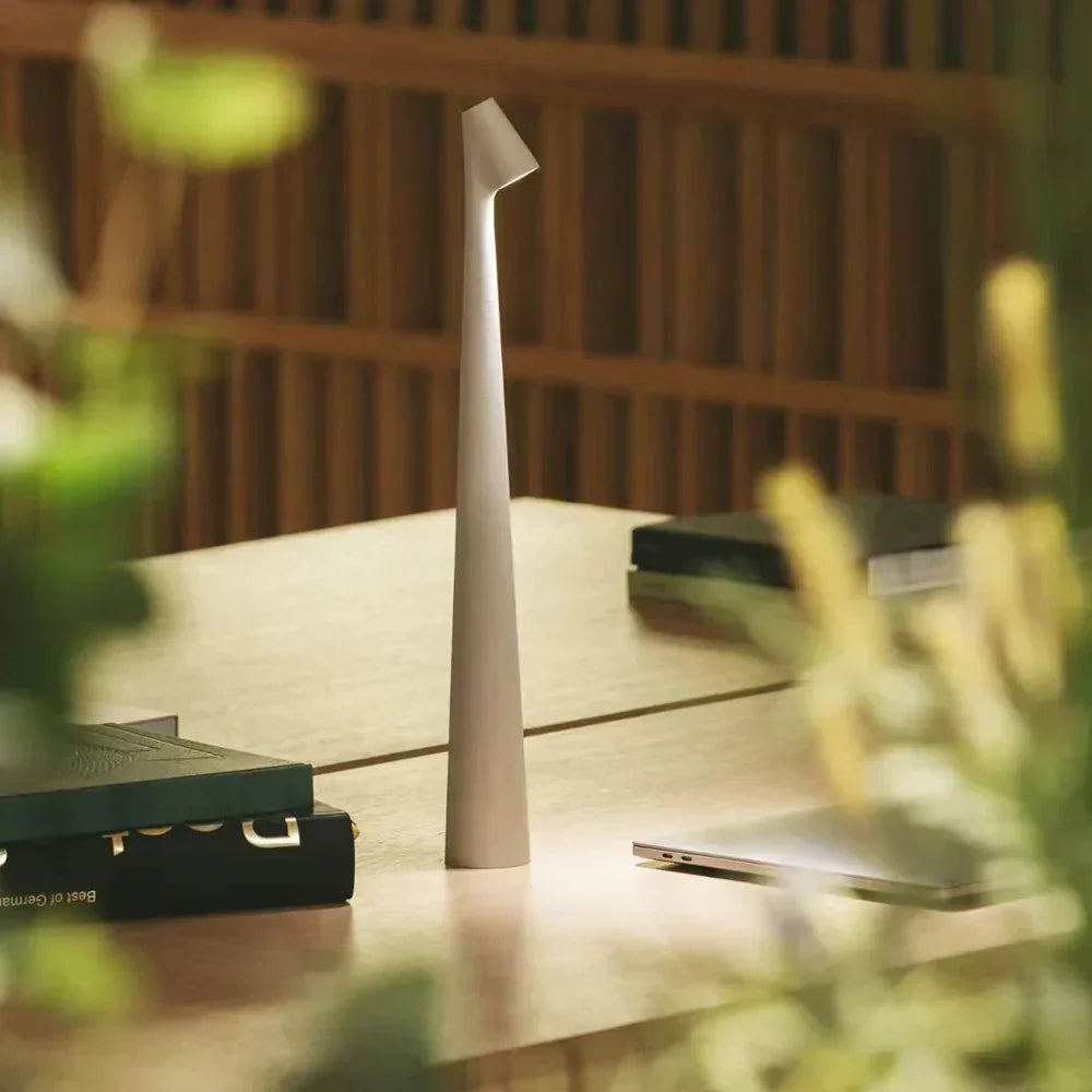 Rechargeable wireless table lamp with a slim base, available in several sizes