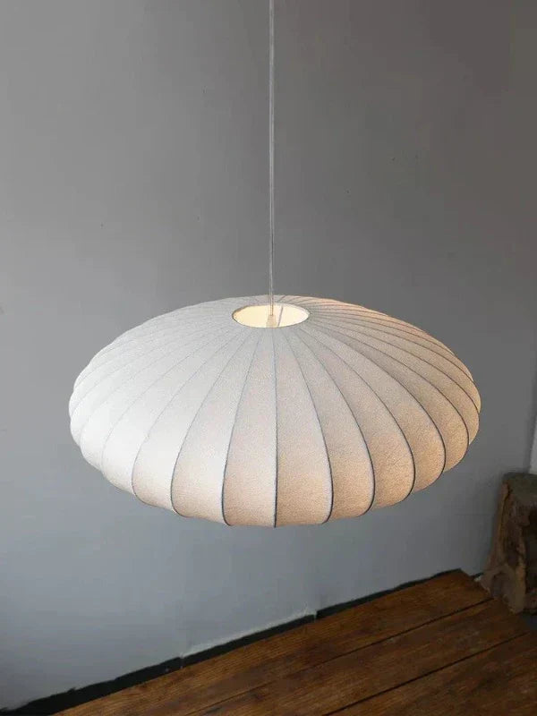 Pendant light with a silk shade and crystal crown for luxurious interiors