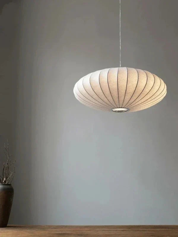 Pendant light with a silk shade and crystal crown for luxurious interiors