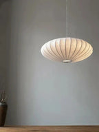Pendant light with a silk shade and crystal crown for luxurious interiors