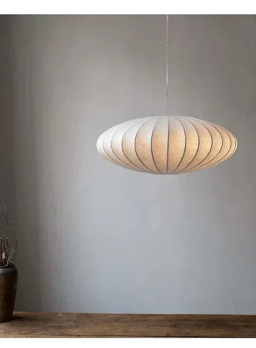 Pendant light with a silk shade and crystal crown for luxurious interiors