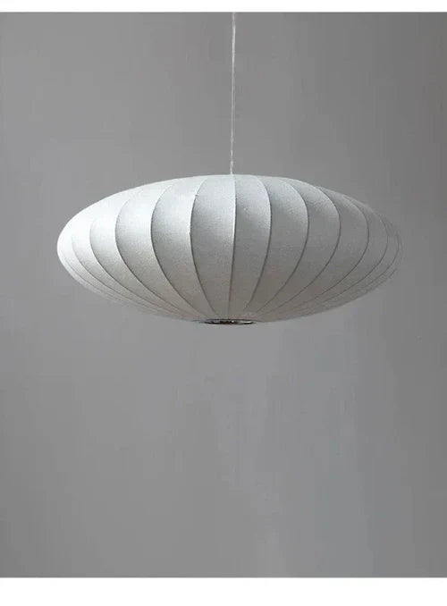Pendant light with a silk shade and crystal crown for luxurious interiors