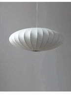Pendant light with a silk shade and crystal crown for luxurious interiors