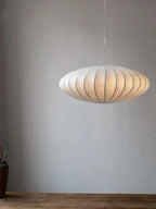 Pendant light with a silk shade and crystal crown for luxurious interiors